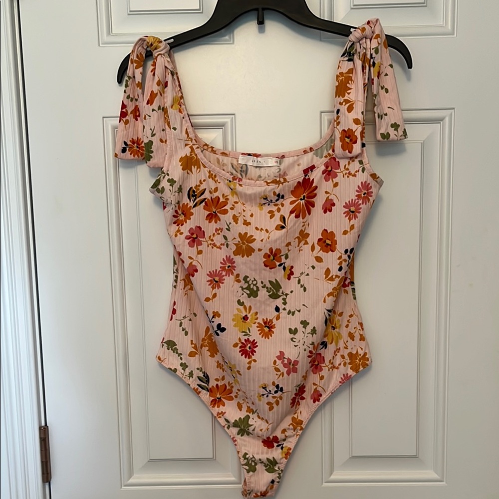 Lush Floral Bodysuit with Pink and Orange Accents